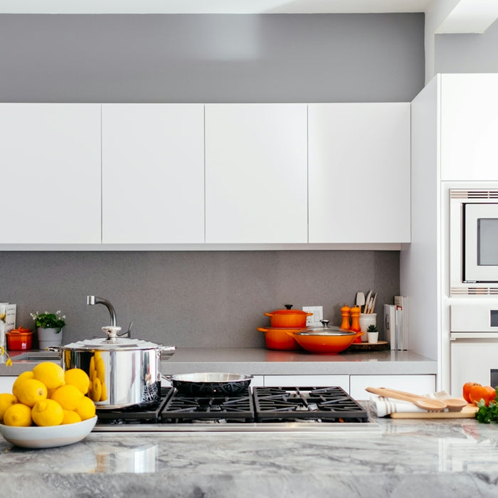 modern white kitchen with marble island