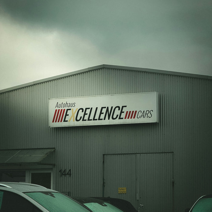Autohaus excellence cars building with cars parked outside
